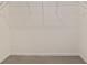 Walk-in closet featuring white wire shelving and tile flooring at 4892 Nw 39Th Loop, Ocala, FL 34482