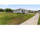 A well maintained lawn surrounds a single-story home with attached garage at 4892 Nw 39Th Loop, Ocala, FL 34482