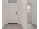Bright foyer with light tile flooring and a view into the bedroom at 4892 Nw 39Th Loop, Ocala, FL 34482