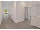 Hallway featuring tile floors and an open view to the backyard at 4892 Nw 39Th Loop, Ocala, FL 34482