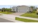 Inviting home with an attached garage, landscaped front yard, and a brick-paved driveway leading to the entrance at 4892 Nw 39Th Loop, Ocala, FL 34482