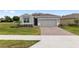 Charming single-story home with a two-car garage and a well-maintained lawn at 4892 Nw 39Th Loop, Ocala, FL 34482