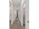Tiled hallway leading to a bedroom and bathroom, creating an open and inviting space at 4892 Nw 39Th Loop, Ocala, FL 34482