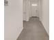 Bright hallway with tiled floors leading to the entrance door and other rooms at 4892 Nw 39Th Loop, Ocala, FL 34482
