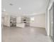 Modern kitchen features a large island and stainless steel appliances in this open-concept design at 4892 Nw 39Th Loop, Ocala, FL 34482