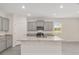 Kitchen with center island, stainless steel appliances, and granite countertops at 4892 Nw 39Th Loop, Ocala, FL 34482