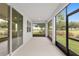 Relax and enjoy the outdoors in this peaceful lanai with screened windows and beautiful views of the well-manicured backyard at 4892 Nw 39Th Loop, Ocala, FL 34482