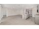 Open-concept kitchen and living room featuring tile flooring and neutral paint at 4892 Nw 39Th Loop, Ocala, FL 34482