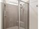 Modern shower with sleek glass doors, dual shower heads, and built-in bench at 4892 Nw 39Th Loop, Ocala, FL 34482