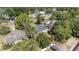 Aerial perspective of home with adjacent properties and surrounding mature trees at 5425 Pecan Rd, Ocala, FL 34472