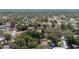 Neighborhood aerial view featuring tree-lined streets and single-Gathering homes in a suburban community at 5425 Pecan Rd, Ocala, FL 34472