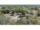 An aerial view of a beautiful home surrounded by mature trees in neighborhood at 5425 Pecan Rd, Ocala, FL 34472