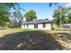 Spacious backyard with a well-maintained lawn, perfect for outdoor activities and relaxation at 5425 Pecan Rd, Ocala, FL 34472