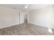 A light-filled bedroom with wood-look flooring and neutral walls provides a serene and inviting space at 5425 Pecan Rd, Ocala, FL 34472