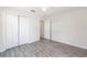 Bright bedroom features hardwood floors and a ceiling fan for comfortable living at 5425 Pecan Rd, Ocala, FL 34472