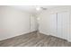 A bright bedroom features hardwood floors and a ceiling fan at 5425 Pecan Rd, Ocala, FL 34472