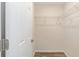 Walk-in closet featuring wire shelving and wood-look floors; functional storage solutions at 5425 Pecan Rd, Ocala, FL 34472