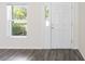 Bright entryway features a white front door, window, and modern flooring at 5425 Pecan Rd, Ocala, FL 34472