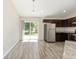 Kitchen with stainless steel appliances and sliding glass door at 5425 Pecan Rd, Ocala, FL 34472