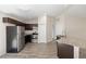 Modern kitchen with stainless steel appliances, granite countertops, and open layout at 5425 Pecan Rd, Ocala, FL 34472