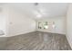 Bright living room with vaulted ceiling and sleek flooring at 5425 Pecan Rd, Ocala, FL 34472