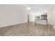 Open-concept living room featuring sleek flooring and a view of the kitchen at 5425 Pecan Rd, Ocala, FL 34472