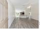 Open-concept living space features stylish wood-look floors, high ceilings and ample natural light at 5425 Pecan Rd, Ocala, FL 34472