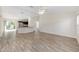 Spacious living room with modern flooring that opens to the kitchen at 5425 Pecan Rd, Ocala, FL 34472