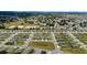 An extensive aerial perspective features a large neighborhood with consistent home designs, tidy landscaping, and open spaces at 6265 Sw 88Th Loop, Ocala, FL 34476