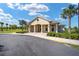 Attractive clubhouse exterior featuring a covered entrance, columns, and lush landscaping, perfect for community activities at 6265 Sw 88Th Loop, Ocala, FL 34476