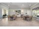 Inviting common area with dining tables and cushioned chairs, perfect for gatherings and socializing at 6265 Sw 88Th Loop, Ocala, FL 34476