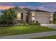 Charming single-story home with a well-manicured lawn, stone accents, and a two-car garage at 6265 Sw 88Th Loop, Ocala, FL 34476