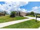 Charming single-Gathering home with a well-manicured lawn, blooming flowers, and a welcoming two-car garage at 6265 Sw 88Th Loop, Ocala, FL 34476