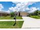 Inviting single-Gathering home with a lush lawn, colorful flowers, and a convenient two-car garage at 6265 Sw 88Th Loop, Ocala, FL 34476