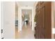 Open foyer with tile flooring leading into a well-lit home and view into a bedroom at 6265 Sw 88Th Loop, Ocala, FL 34476