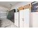 Organized garage with ample storage cabinets, providing a clean and functional space for vehicles and tools at 6265 Sw 88Th Loop, Ocala, FL 34476