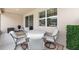 Cozy screened lanai with seating area and table, perfect for outdoor relaxation and entertainment at 6265 Sw 88Th Loop, Ocala, FL 34476