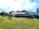 Lush backyard featuring a screened-in lanai and a well-maintained lawn at 6312 Sw 60Th Ct, Ocala, FL 34474