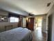 Inviting bedroom features a comfortable bed, walk-in closet and access to an en-suite bathroom at 6312 Sw 60Th Ct, Ocala, FL 34474