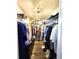 Walk-in closet with custom shelving and hardwood floors offer ample storage at 6312 Sw 60Th Ct, Ocala, FL 34474