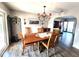 Bright dining room featuring wood flooring, matching table and chairs, and decorative lighting at 6312 Sw 60Th Ct, Ocala, FL 34474