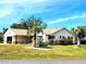 Attractive home exterior featuring a lush, green lawn, and inviting landscaping at 6312 Sw 60Th Ct, Ocala, FL 34474