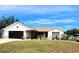 Charming single-story home with a well-manicured lawn and attached garage at 6312 Sw 60Th Ct, Ocala, FL 34474