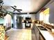 Bright kitchen with stainless steel appliances, tile flooring and a view into another room at 6312 Sw 60Th Ct, Ocala, FL 34474