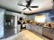 Well-lit kitchen with stainless steel appliances, granite countertops, and modern cabinetry at 6312 Sw 60Th Ct, Ocala, FL 34474
