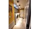 Bright laundry room with modern washer and dryer, overhead lighting, and storage cabinets at 6312 Sw 60Th Ct, Ocala, FL 34474