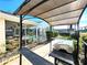 Outdoor kitchen with a built-in grill, lanai, and a covered patio at 6312 Sw 60Th Ct, Ocala, FL 34474