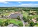 An aerial view of a golf course community with manicured greens and lush landscaping at 6680 Sw 179Th Court Rd, Dunnellon, FL 34432