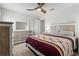 Comfortable bedroom featuring a ceiling fan, neutral walls, and a stylish decorative color scheme at 6680 Sw 179Th Court Rd, Dunnellon, FL 34432