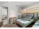 Bedroom showing a bunkbed, a ceiling fan, and a large window with plenty of natural light at 6680 Sw 179Th Court Rd, Dunnellon, FL 34432